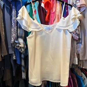 The vanity room flutter sleeve off shoulder tank. Beautiful